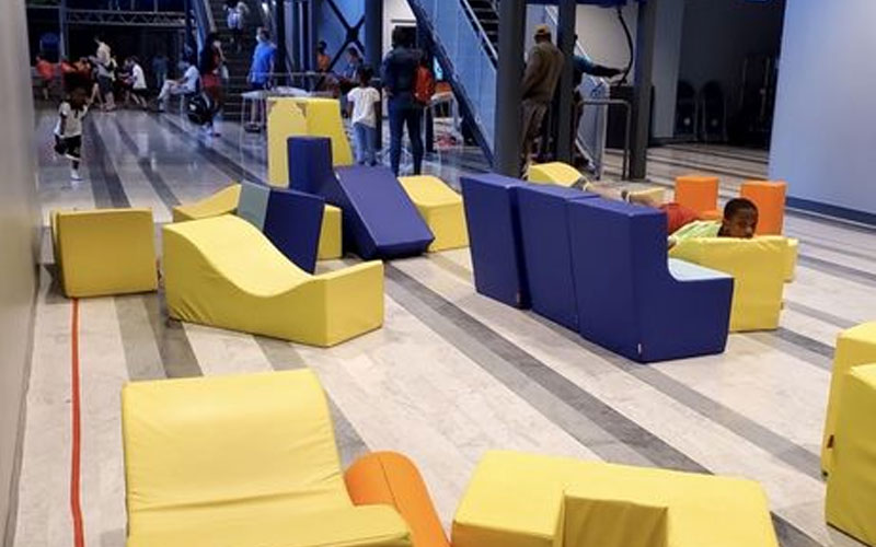 Kids soft play area with foam blocks and sensory toys in a Barcelona shopping center with indoor playground