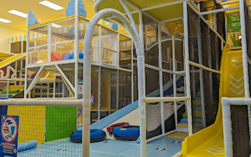Play cafe setup with coffee bar and toddler play zone
