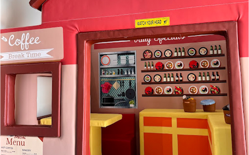 Role play area featuring a mini “town” for imaginative games.