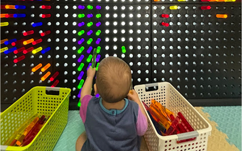 Building block section where kids construct forts and towers together.