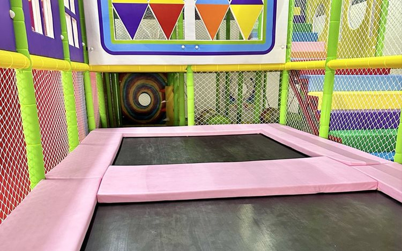 Children enjoying the lively trampoline play zone