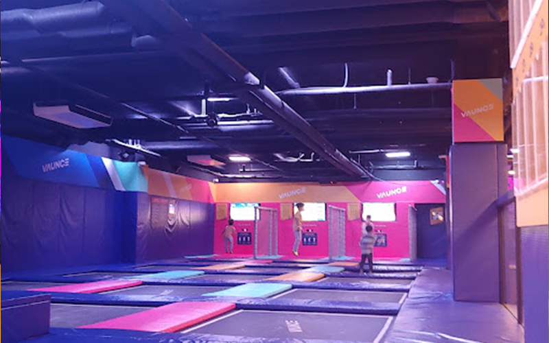 Interactive trampoline game station for active play