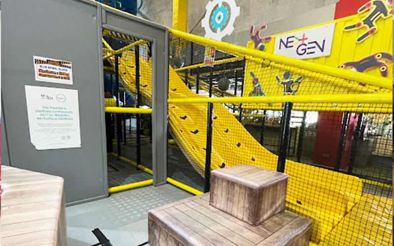 Colorful kids’ magic slide inside the indoor play cafe