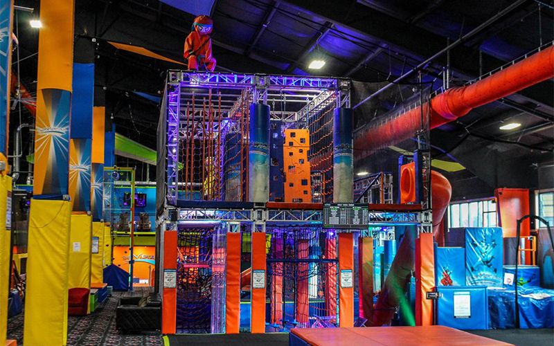 Ninja warrior obstacle trampoline game area for active challenges