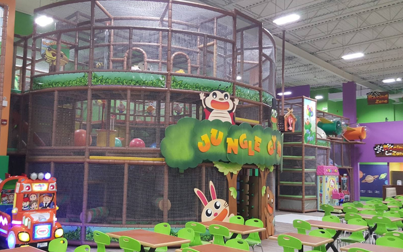 Kids exploring the maze play area in the indoor fun park