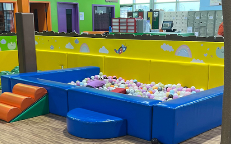 Bright and colorful kids ball pool in indoor play center