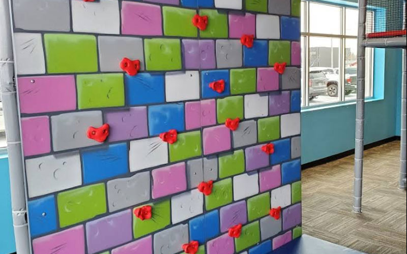 Kids climbing wall encourages strength and agility