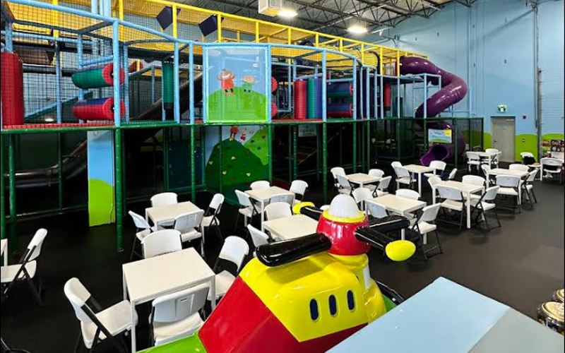Dining area with sightlines into play zones so parents can relax