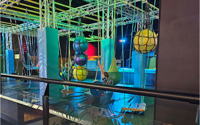 Obstacle game area encouraging friendly challenges