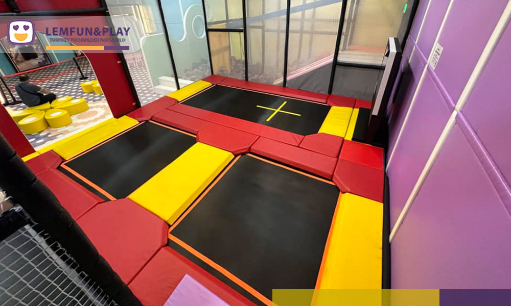 Safe and colorful kids trampoline area with basketball hoops designed for high-energy play at CHILDLIKE Hong Kong.