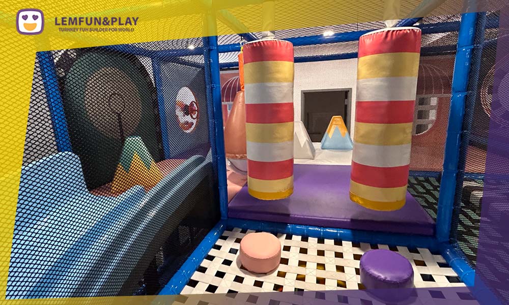Multi-level candy castle maze play area for school-aged children featuring colorful lollipop-shaped slides.