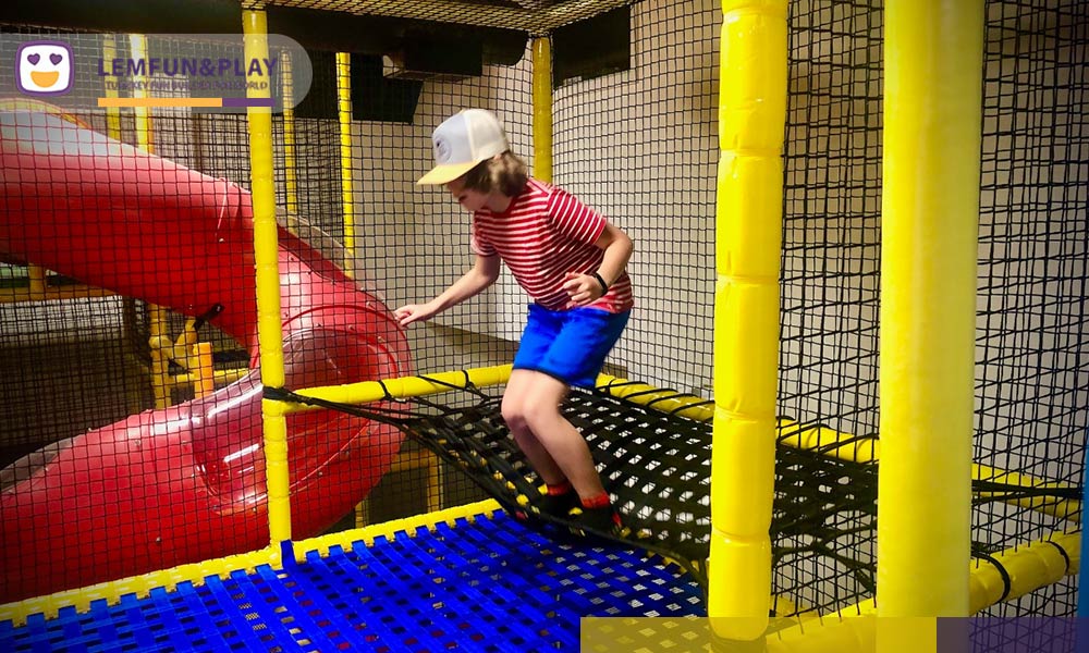 An interactive kids obstacle game integrated within the maze play area, featuring 