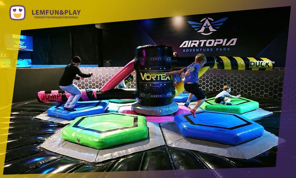 Dynamic wipe out challenge game for trampoline parks, offering high-energy interactive play.