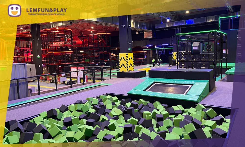 High-density foam pit for trampoline parks with extra-thick safety padding and ASTM compliant netting.
