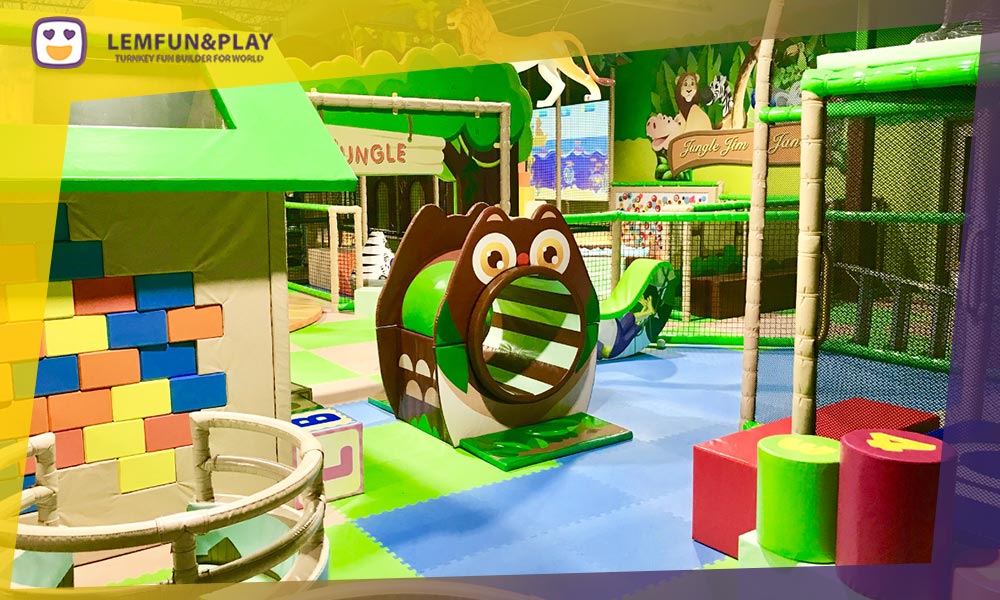 Dedicated toddler soft play area with animal-themed foam climbers and sensory toys, part of the premium jungle themed commercial indoor play equipment in New Jersey.