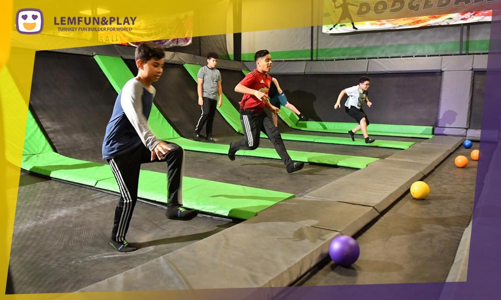 Dedicated trampoline dodgeball game set with safety netting and professional padding.