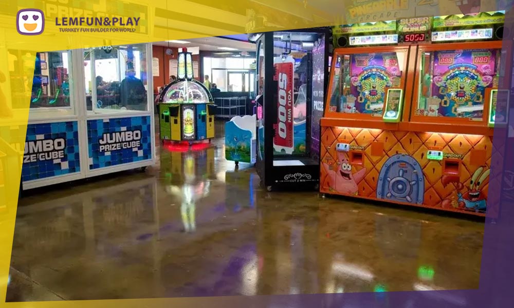Vibrant arcade game area with various electronic gaming machines for indoor play centers.