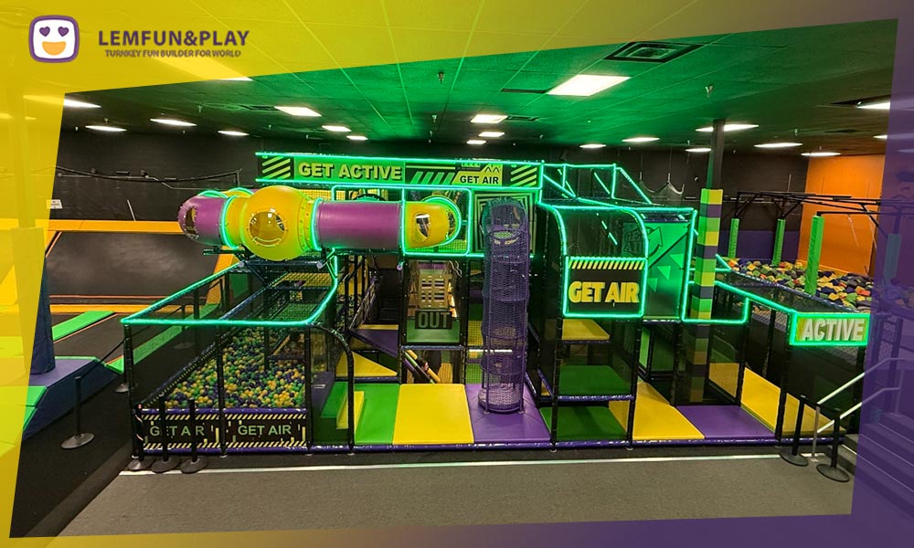 Aerial 3D design overview of a comprehensive indoor playground featuring soft play, slides, and toddler zones.
