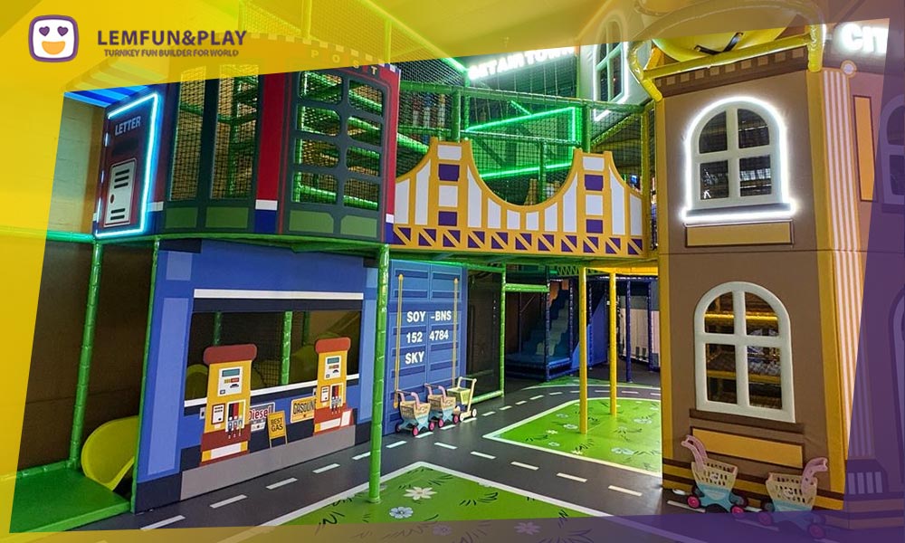 Complex multi-level indoor maze play area with safety netting and interactive crawl tunnels for children.