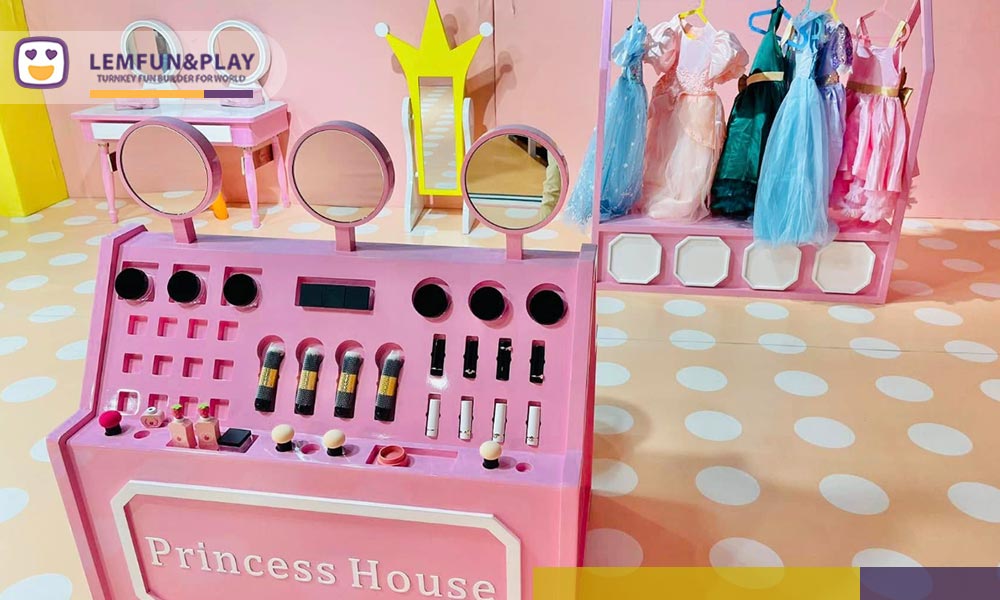 Custom commercial indoor playpark equipment featuring a pink Princess House role-play vanity station