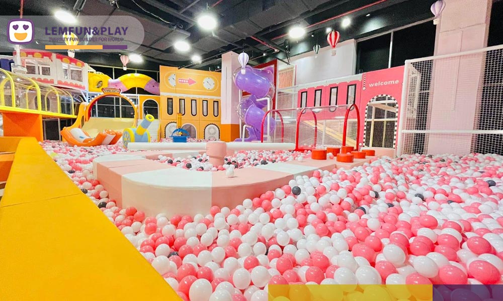 Large ball pool integrated with custom commercial indoor playpark equipment by Lemfun