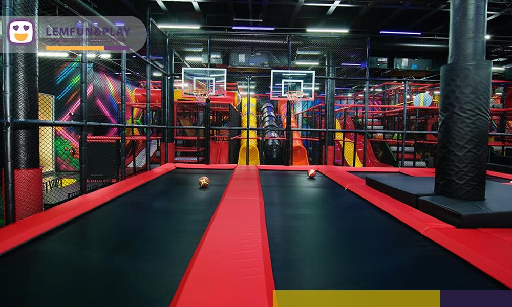 Trampoline basketball game zone utilizing heavy-duty commercial indoor trampoline park equipment.