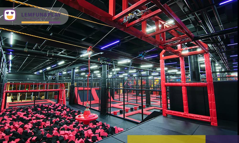 Space-themed trampoline zipline game set installed at Jump Club Arena in Los Angeles.