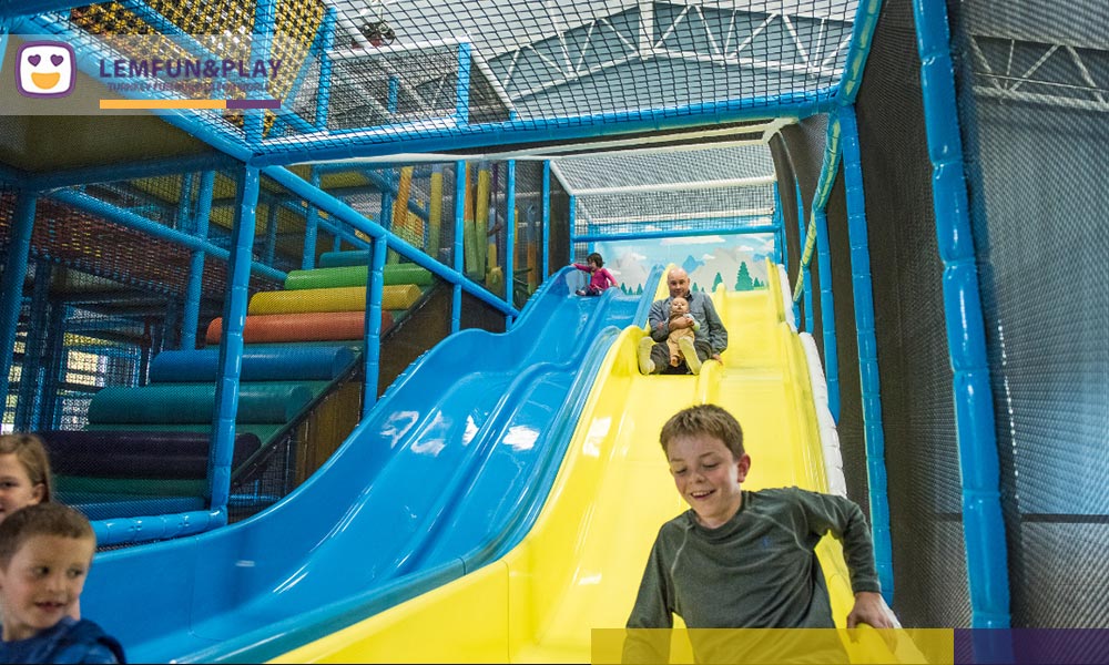 Intimately scaled toddler area and heavy-duty inflatable castle, designed with lowered datum lines for optimal parental sightlines and secure structural boundaries.
