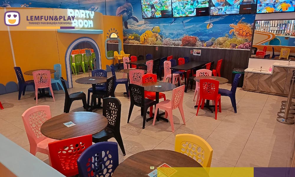 Open F&B seating lounge and parent relaxation area equipped with real-time CCTV monitoring displays at Little Pirates Playland, Kuala Lumpur.