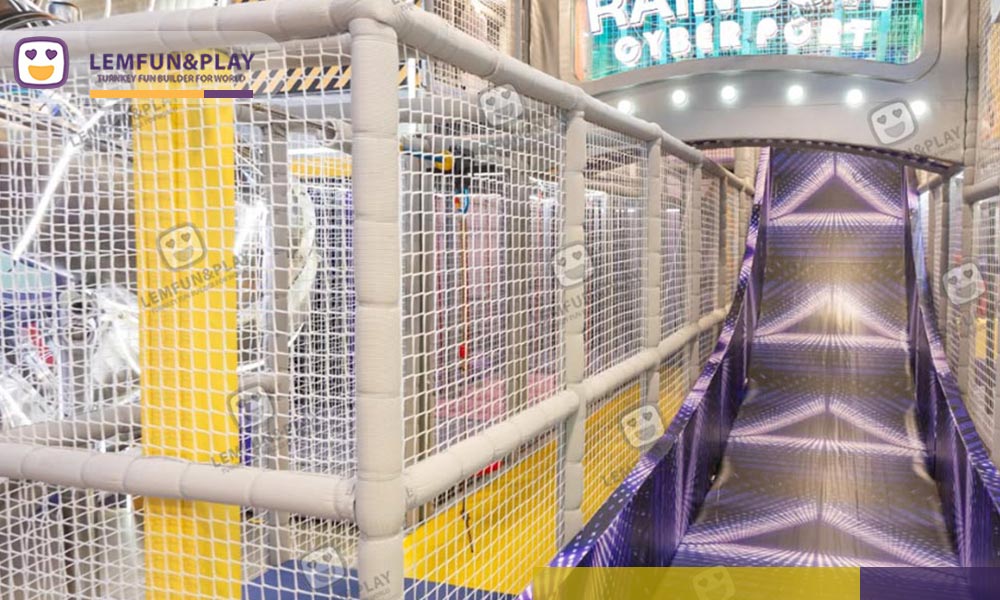 Interactive trampoline area in a Macaroon Themed Customized Indoor Playground in HongKong with yellow safety padding
