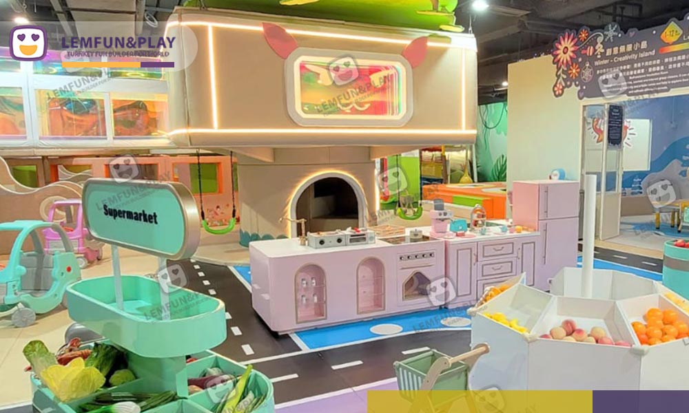 Pastel macaroon kids role play house area with a mint-green play supermarket and pink mini kitchen set in Tsuen Wan, Hong Kong.
